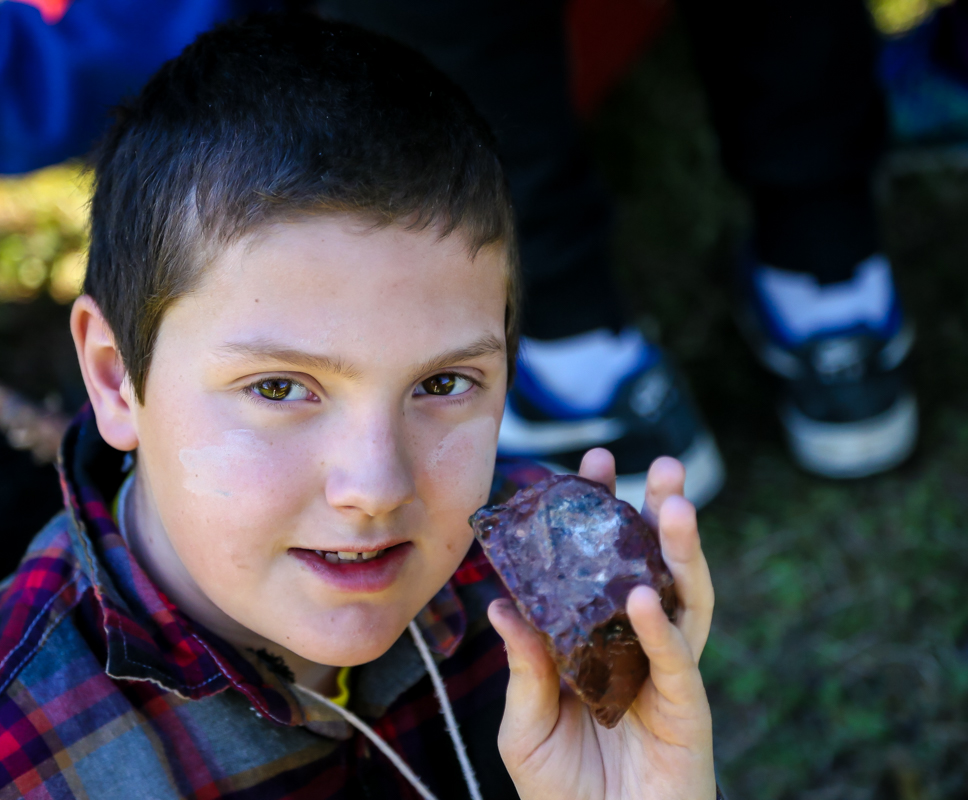 student holding rock