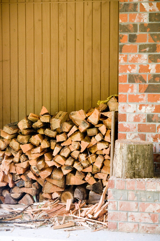 chopped wood near fireplace