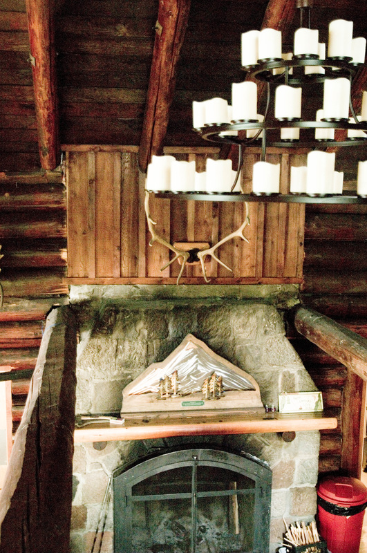 chandelier and fireplace in lodge