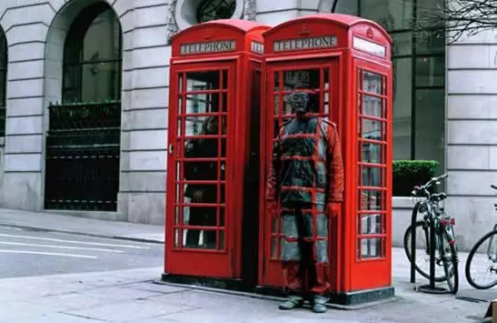 Liu Bolin camouflaged against phone booth