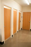 single-occupancy restroom stalls in dining hall