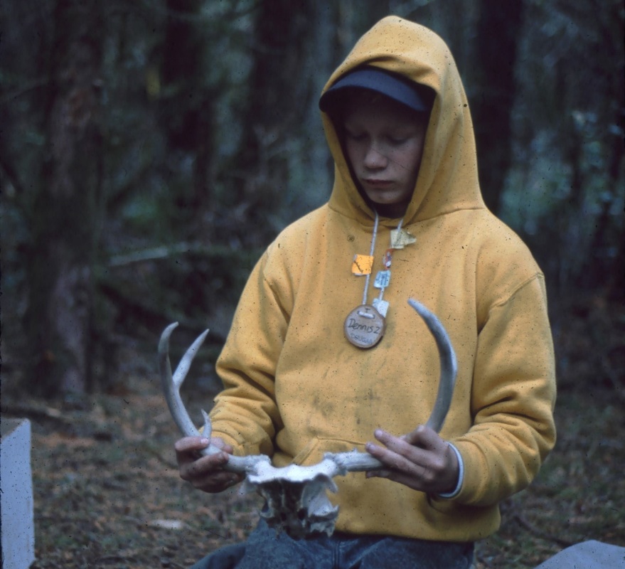 student holding antlers