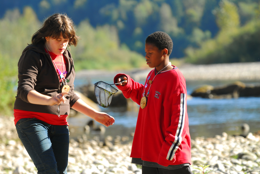 Student leader helping a student with critter catch