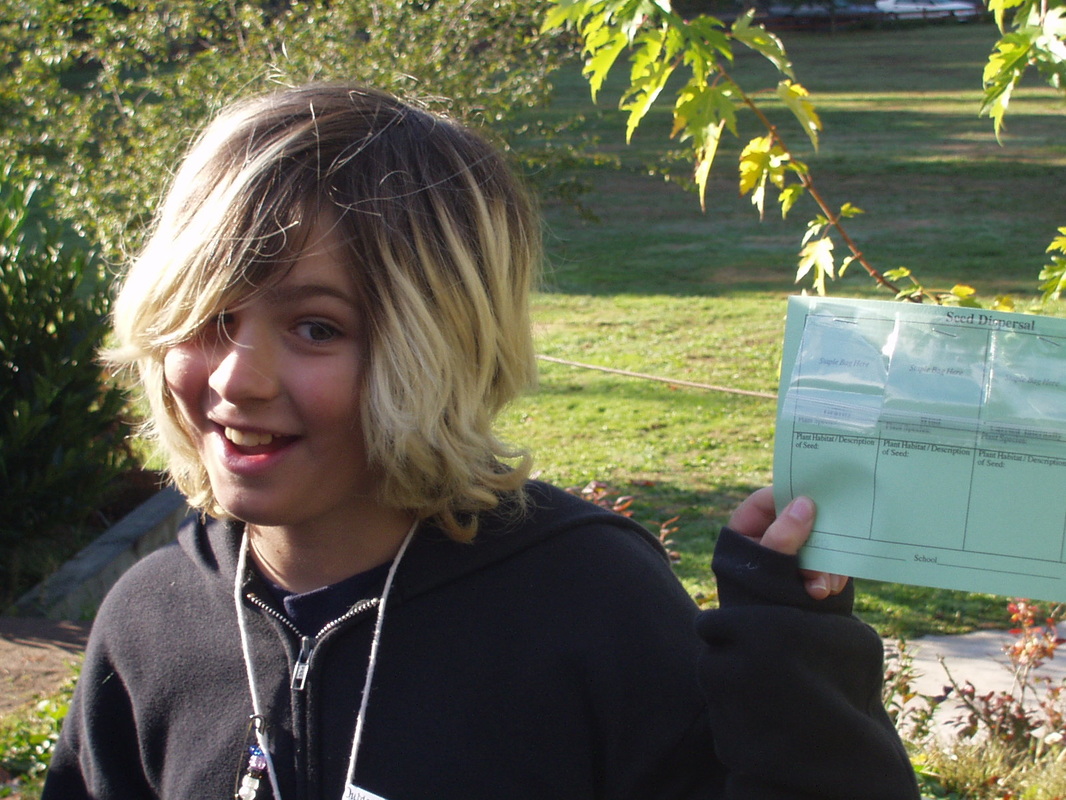 student with seed dispersal card